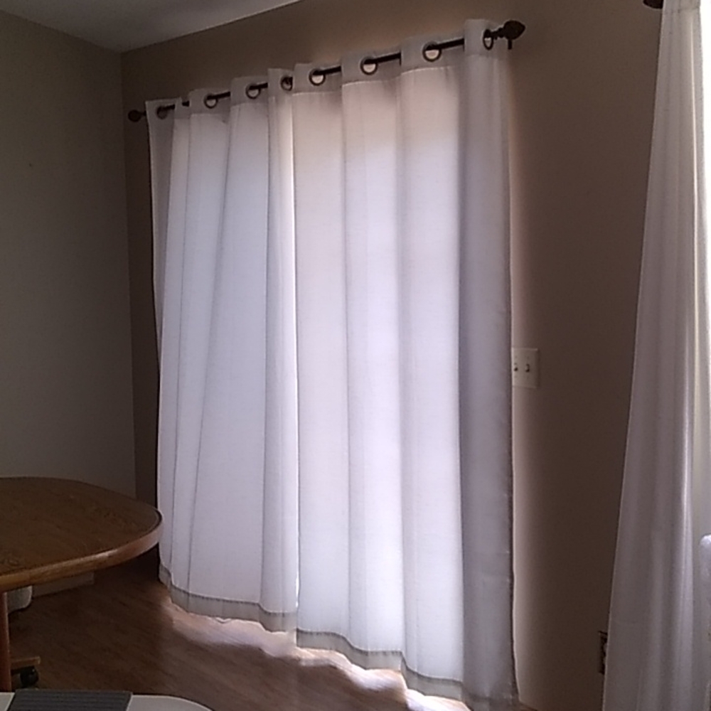 two pair white drapes